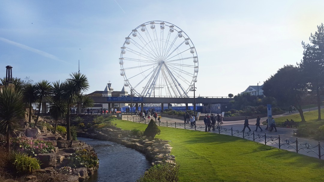 A bright afternoon in Bournemouth's lower gardens looking over the rockery towards the big wheel.